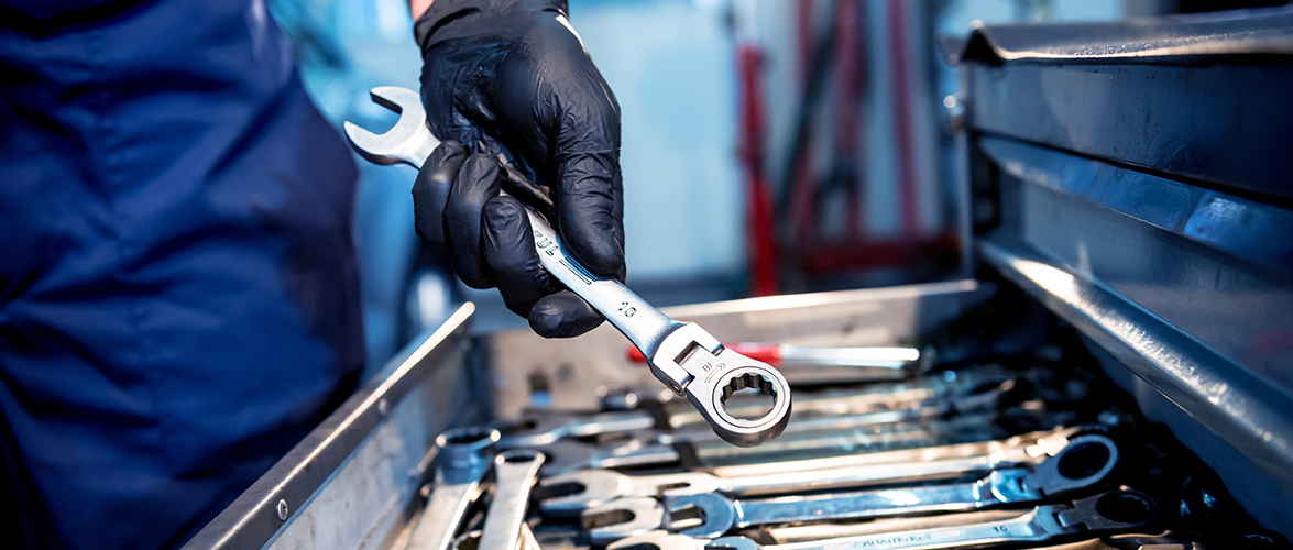 Tools at the hands. Auto repair service